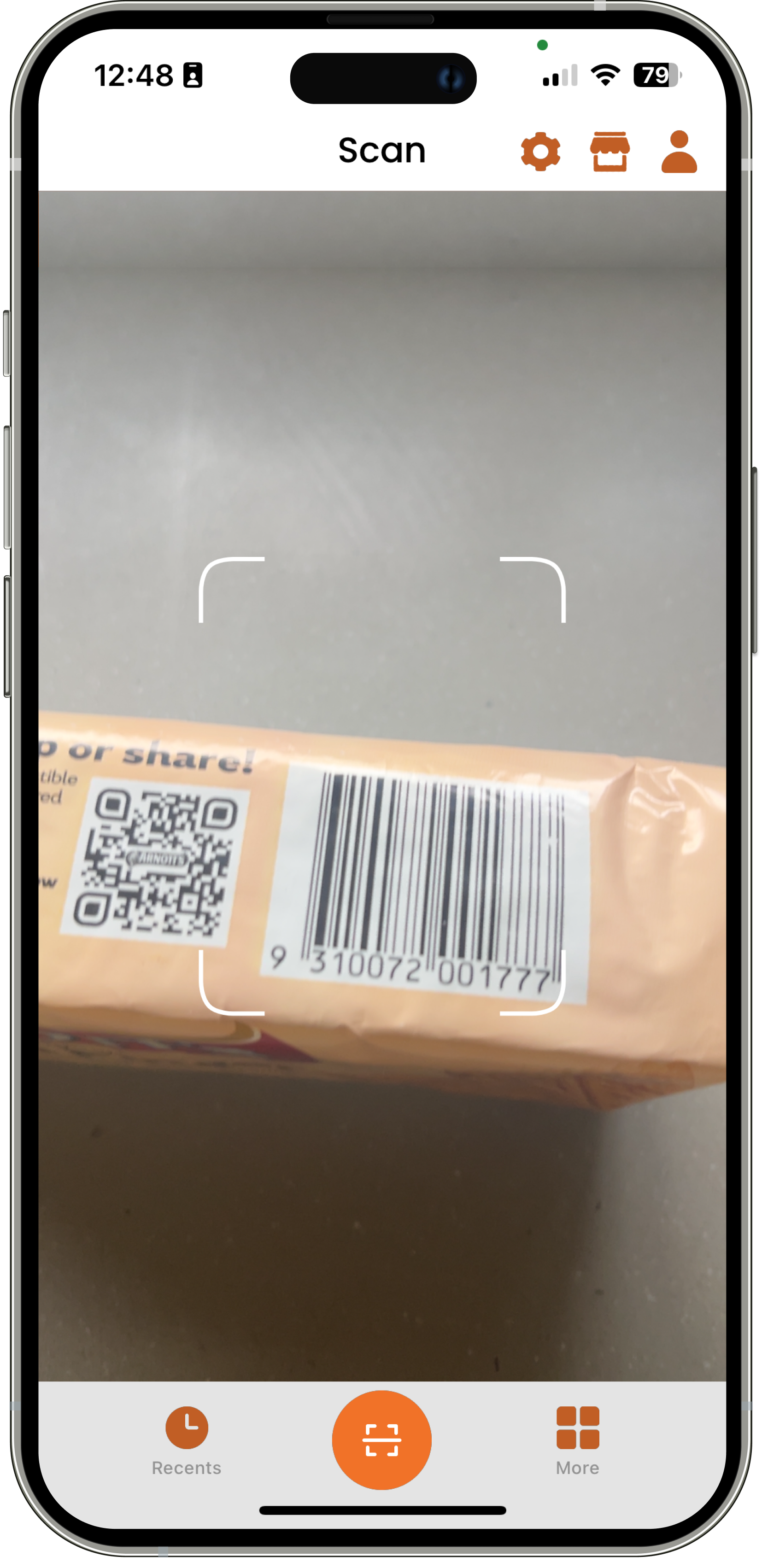 App scanning a packaged product with barcode and QR code.