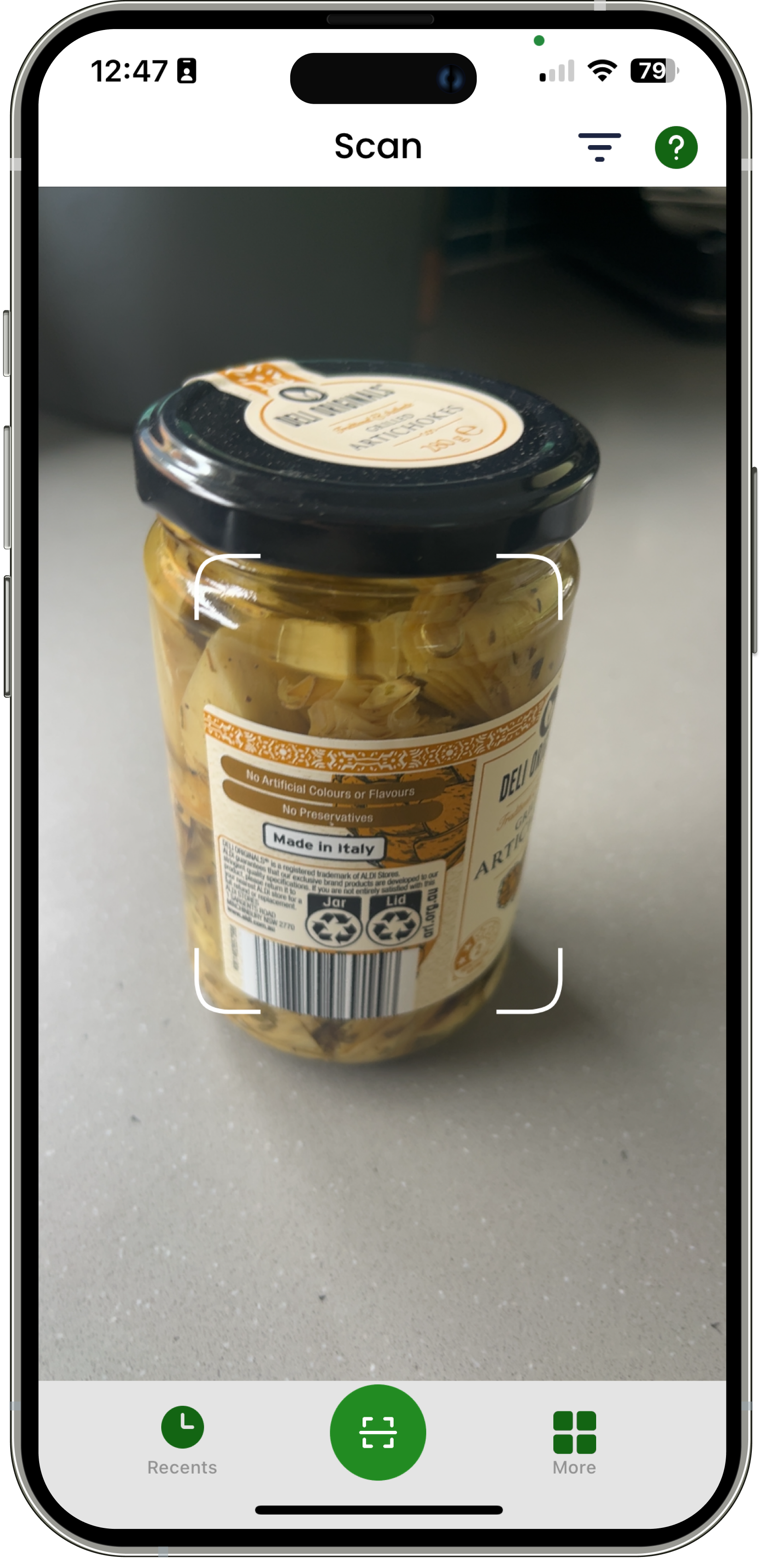 App scanning a jar of preserved artichokes on a countertop.
