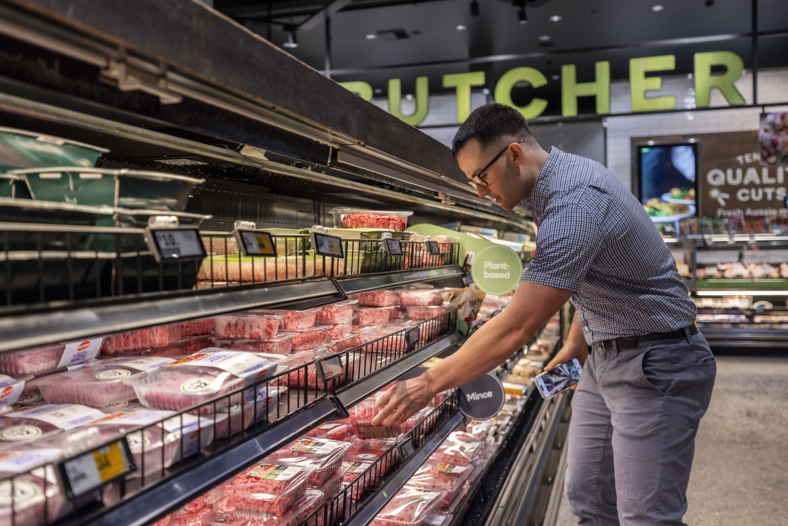 Man selecting a packaged meat product to scan with FoodSwitch
